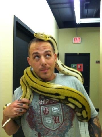 Jay Kaps holding a large ball python from the Green Line Morphs collection